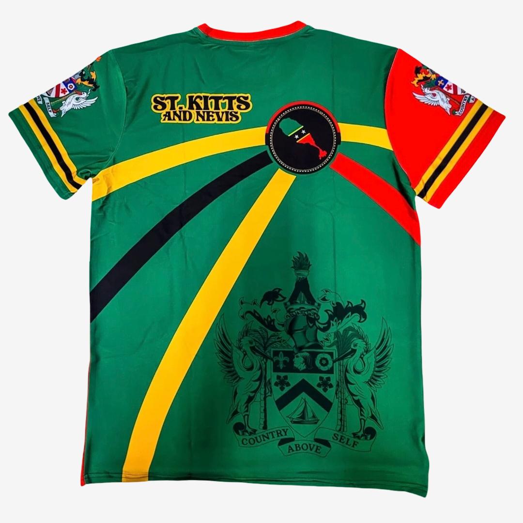 A green short-sleeve athletic jersey with 'ST. KITTS AND NEVIS' printed in yellow on the chest, featuring diagonal yellow and black stripes, a red and yellow shoulder stripe, a circular crest, and a large black coat of arms on the back from ZIONGATES Culcha Shop