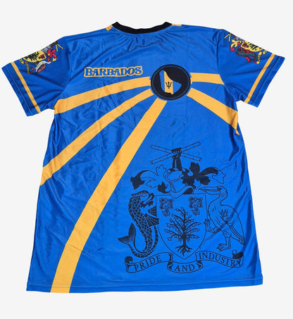 A blue short-sleeve Barbados soccer jersey with yellow sunburst stripes, a central crest, and a large Barbados coat of arms printed on the back.