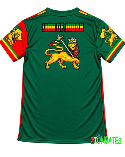 Green short-sleeve Rasta-themed soccer jersey with 'LION OF JUDAH' text and a large lion graphic on the back, featuring red and yellow sleeve accents, ZIONGATES Culcha Shop.