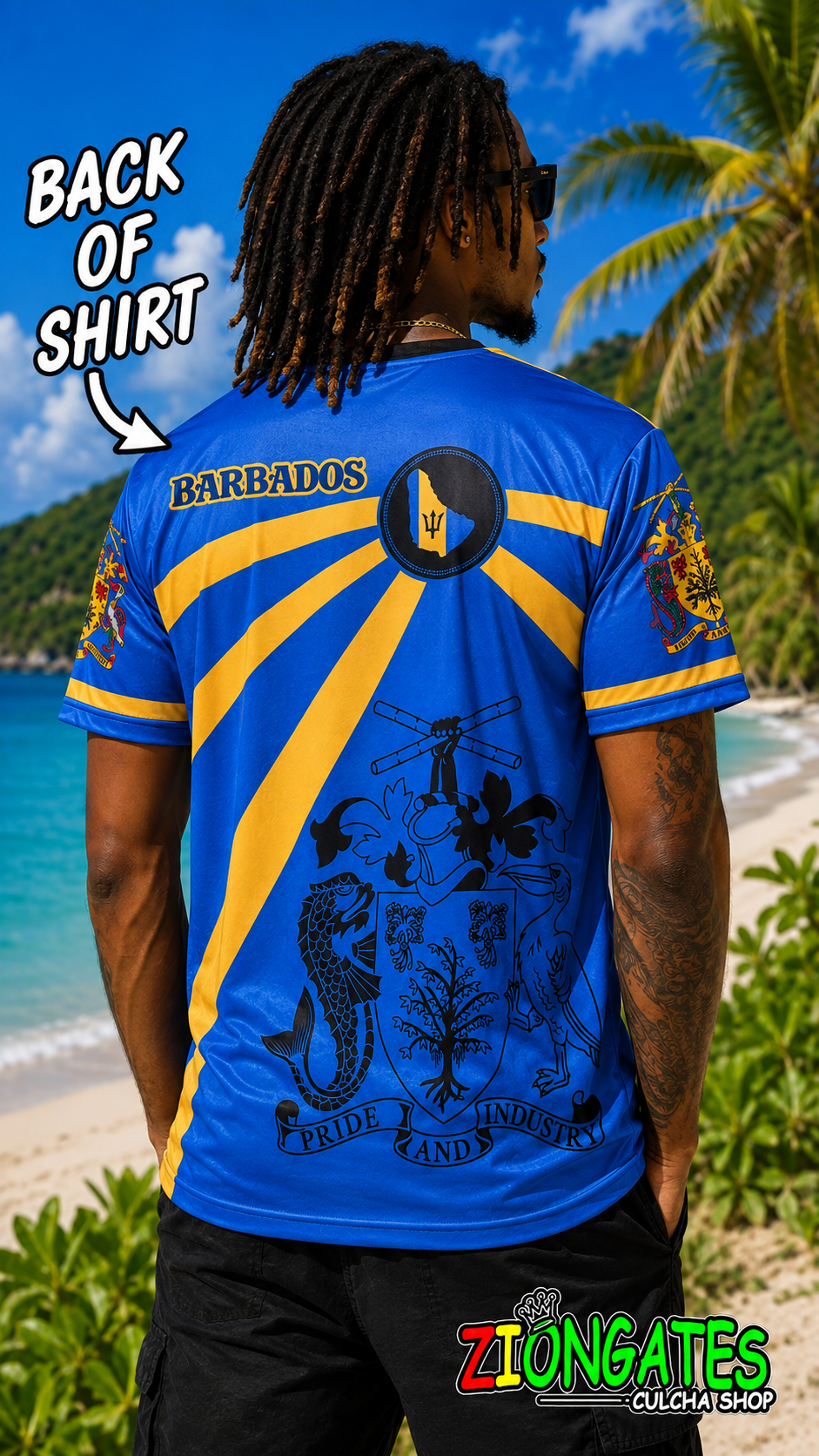A man shown from the back wearing a bright blue short-sleeve Barbados  shirt with bold yellow graphic stripes and a large black crest-style print on the back, set against a tropical beach background,  and a 'ZIONGATES' logo appears at the bottom right.